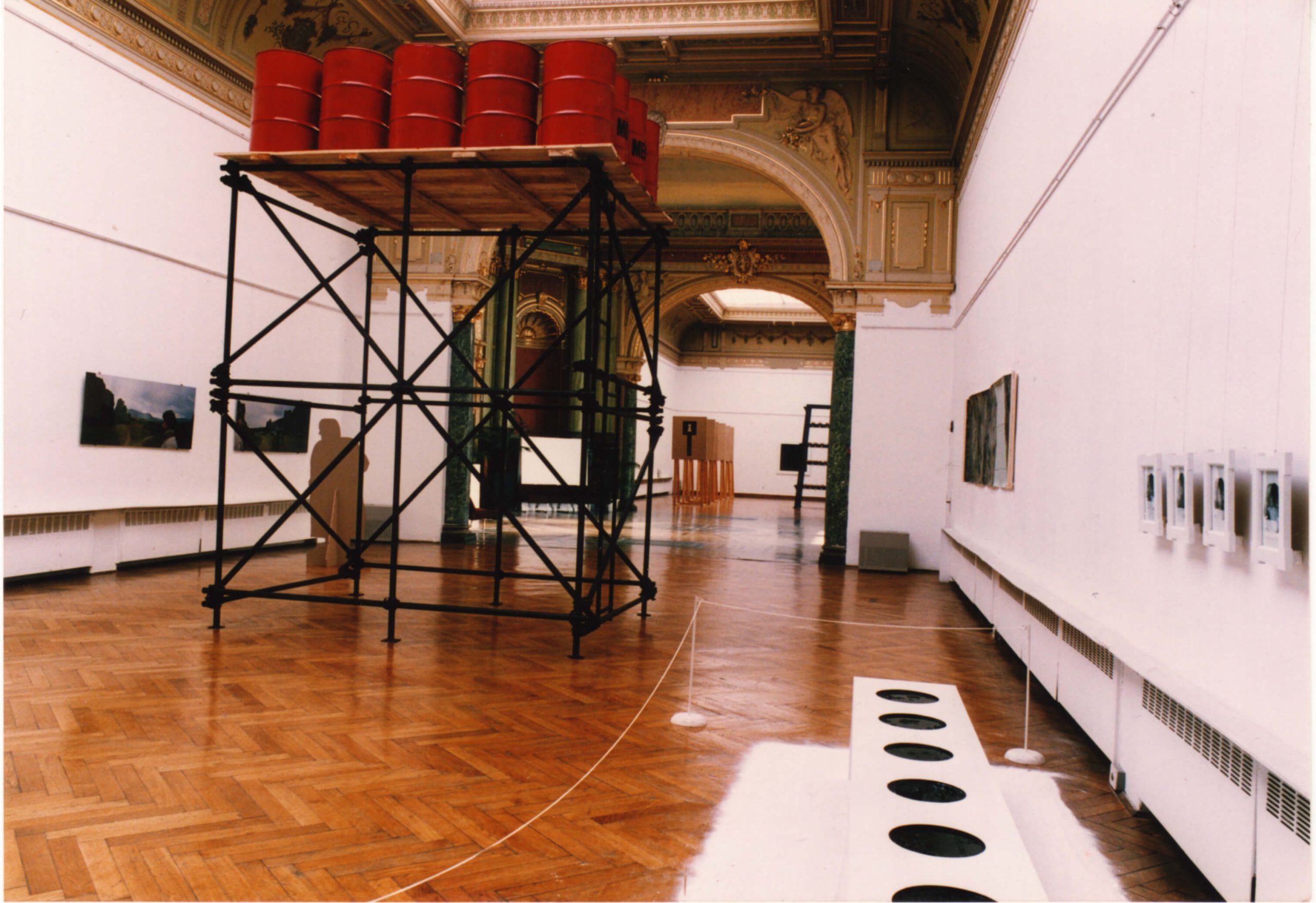 Twenty red Barrels placed on a construction during an Art Exhibit